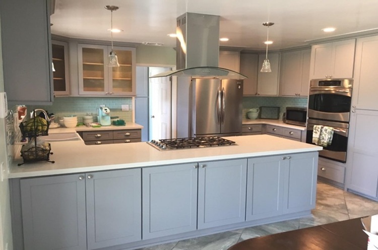 Modern kitchen featuring light-colored laminate countertop
